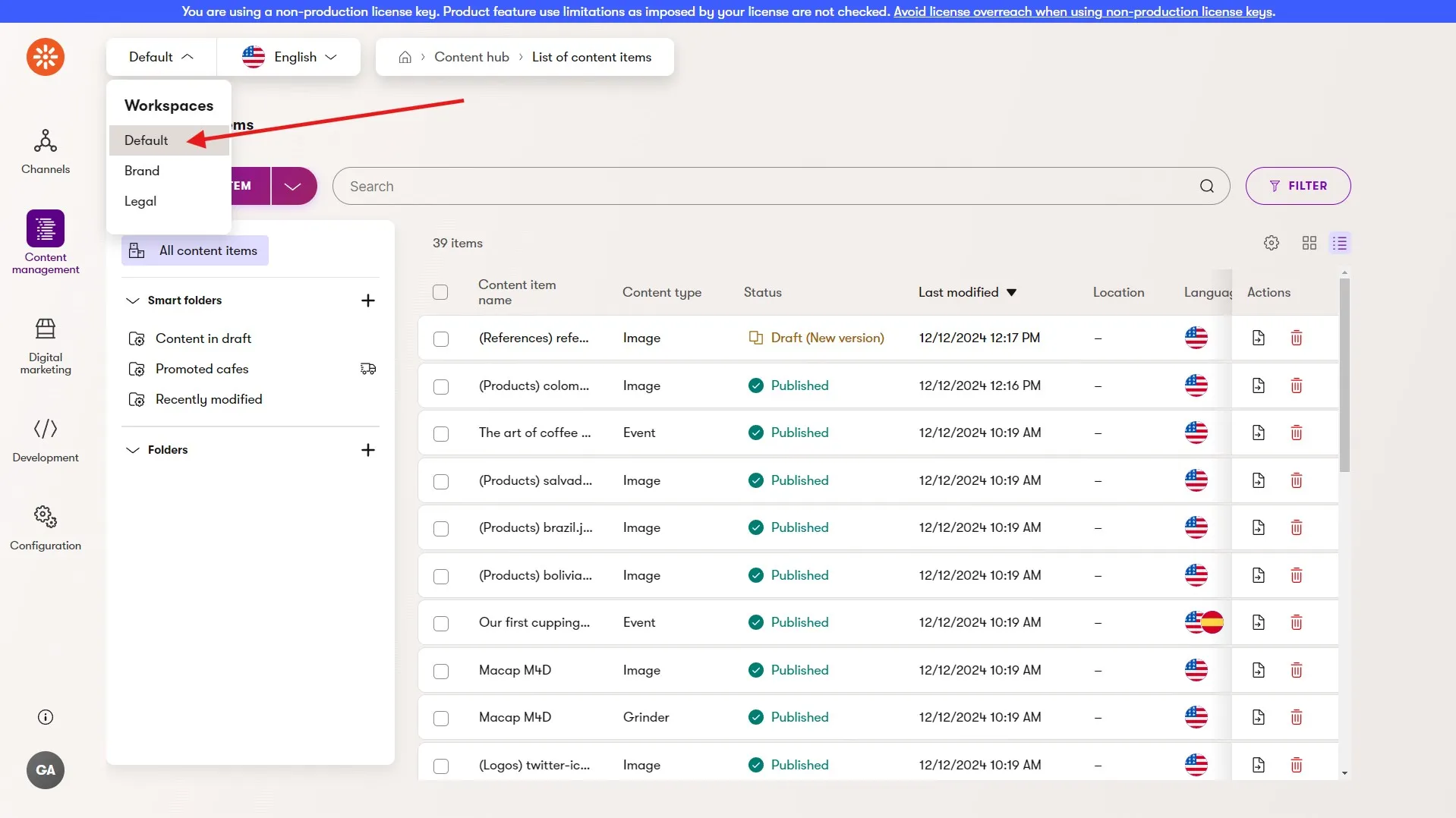 Content hub workspace selector The Content hub content items table listing with the workspaces dropdown menu opened showing multiple available workspaces.